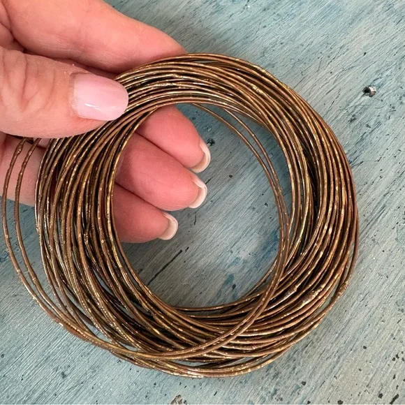 Gold-Tone 43 Interlocking Bangle Bracelets - Picture 9 of 9